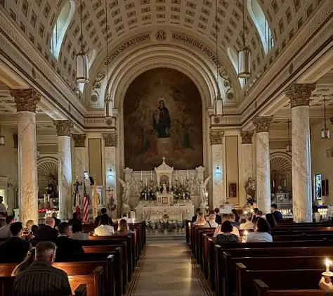 Congregation seated in the nave of Holy Rosary Church, facing the sanctuary